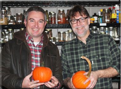 Mark Jensen, right, owner/executive chef of middle fork kitchen bar, and Agriculture Commissioner Ryan Quarles hold Kentucky Proud pumpkins from Stonehedge Farm in the fall of 2016 that Jensen used to make fire-roasted candy pumpkins.