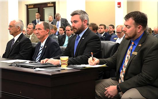 Agriculture Commissioner Ryan Quarles, second from right, testifies in support of House Bill 174 in Wednesday’s meeting of the House Agriculture Committee in Frankfort.
