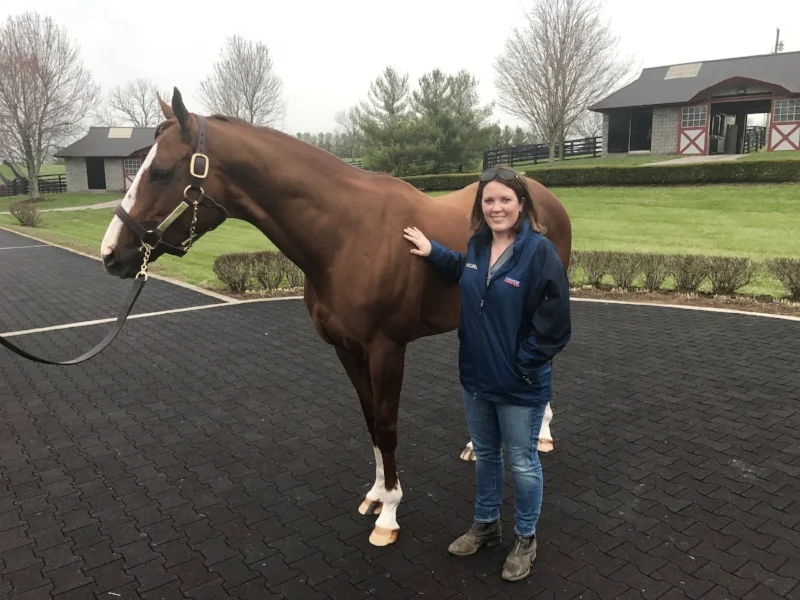 Now a prominent fixture in the Thoroughbred industry, Carrie Gilbert grew up a track rat in Fairport, N.Y., before moving to the Horse Capital of the World and immersing herself in all things equine. She is pictured here with California Chrome.