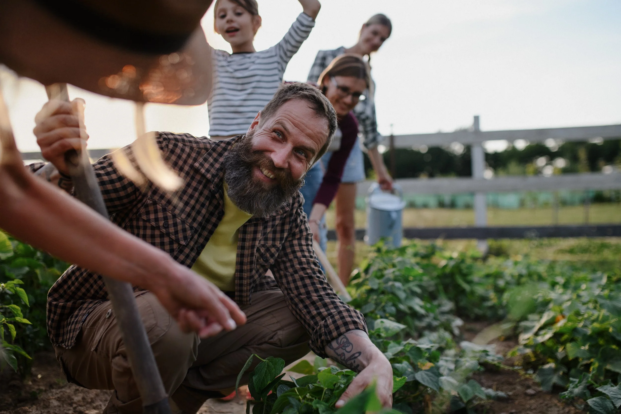 happy-farmers-or-gardeners-working-outdoors-at-com-2022-01-19-00-09-48-utc.jpg