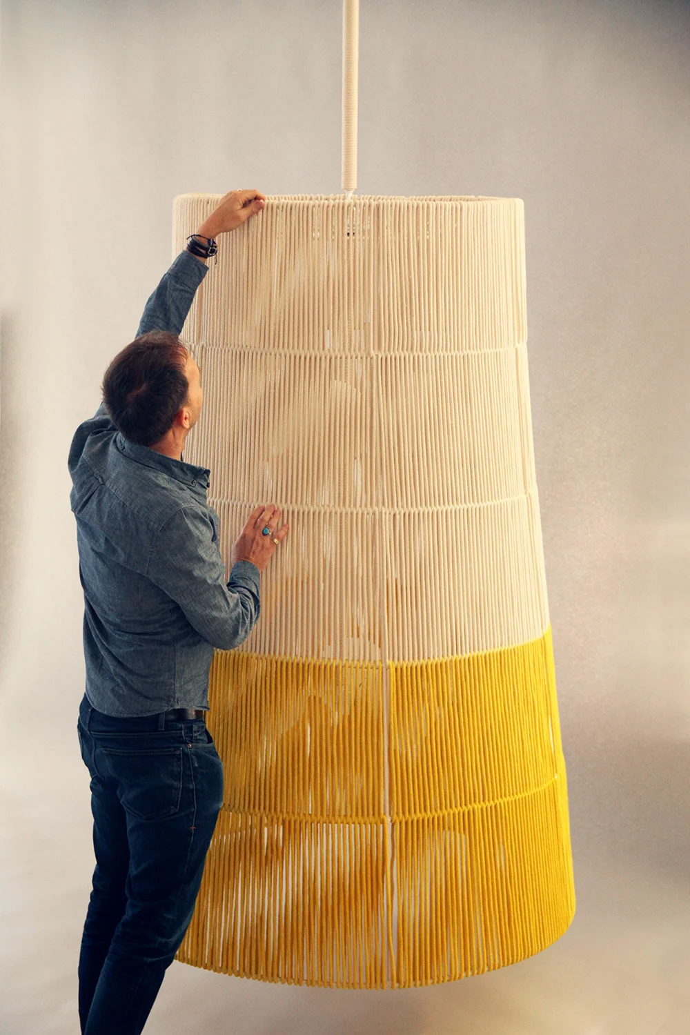 Rope_C-182_Horizon String Tapered Pendant_Large_Yellow_with Chad.jpg