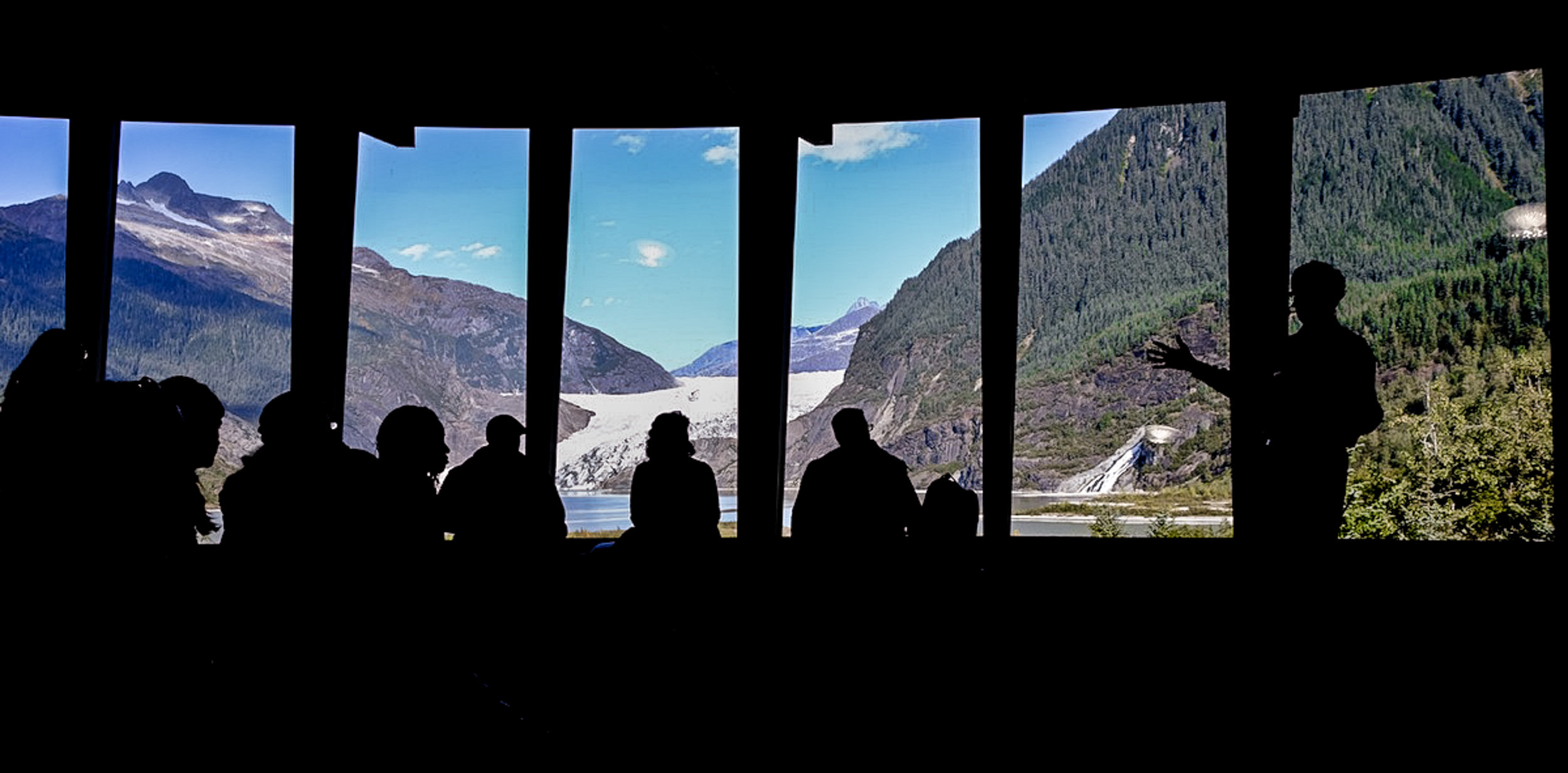 Director John Neary speaks to the Arctic-FROST group at the Mendenhall Glacier Visitor Center.  JONAA©Mia Bennett