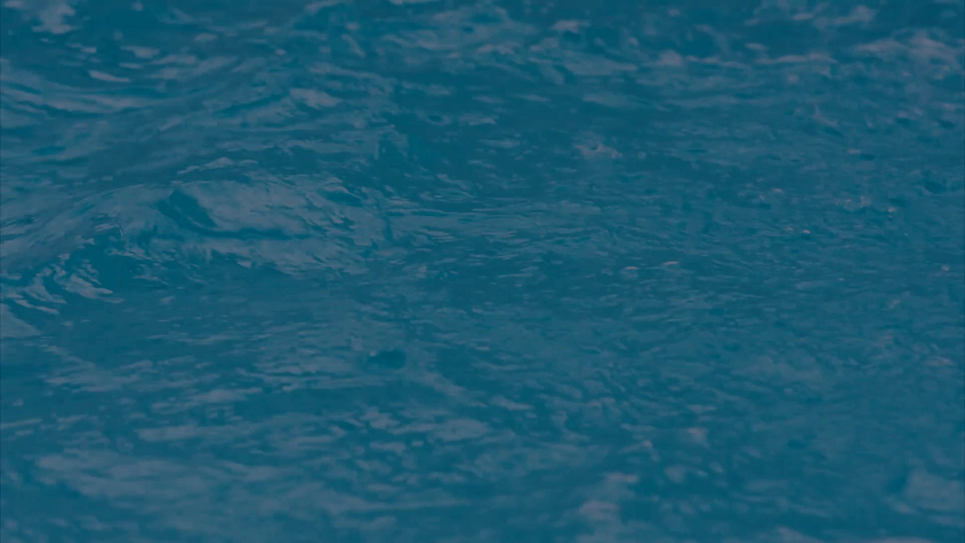 abstract-swimming-pool-water-background-moving-water-with-reflecting-sun.png