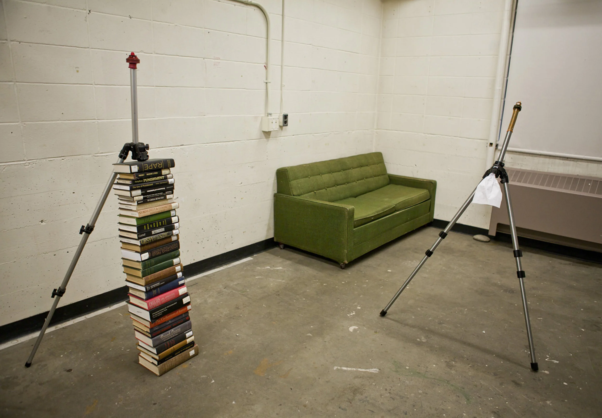 aluminum tripod, book, latex condom, 187 x 80 x 70 cm (Installation view)