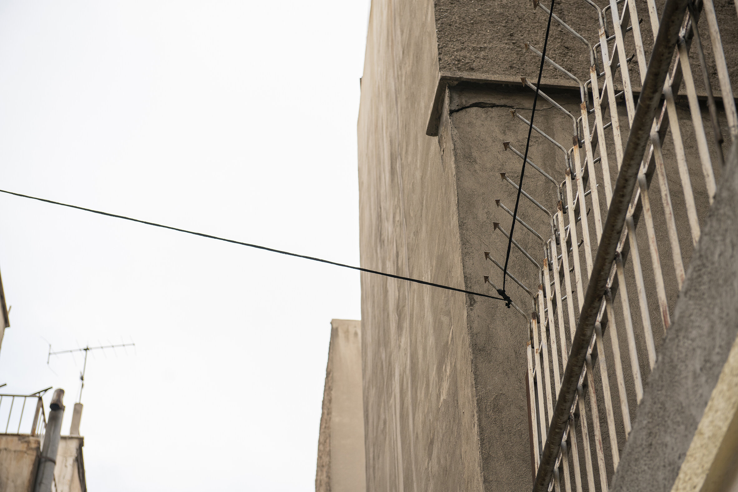  Untitled (Territory of the Semiotic)  49 meters of lace, 4 iron rods, 2 hooks Installation (بدون عنوان (قلمروامرنشانه شناختی  *Formally, similar to the usage of an  Eruv  in Judaism, a 49 meters long rope mad of the same lace used in the entire inst