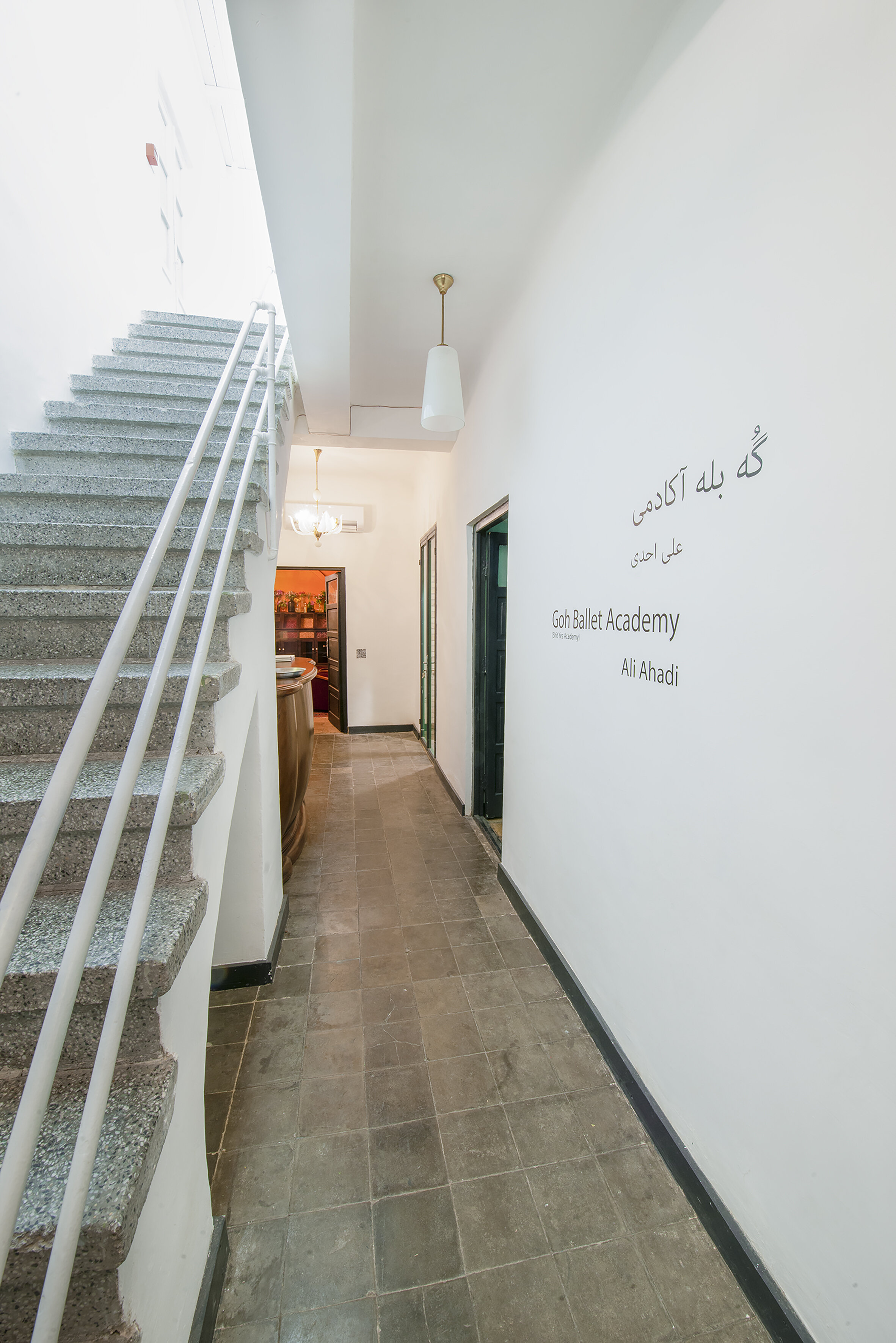  basement view of the gallery toward the gallery’s bathroom, communal room and courtyard. 