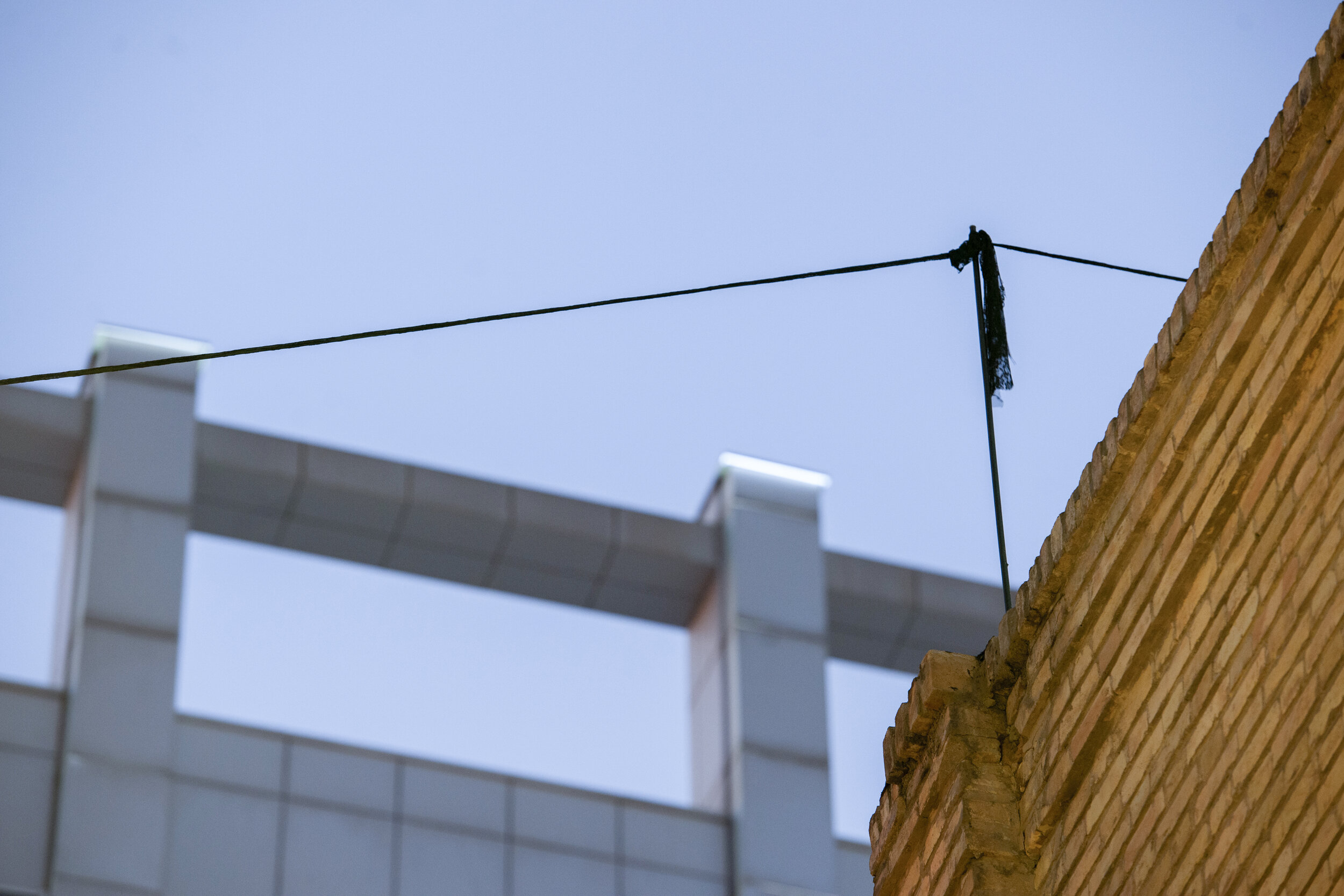  Untitled (Territory of the Semiotic)  49 meters of lace, 4 iron rods, 2 hooks Installation (بدون عنوان (قلمروامرنشانه شناختی   *Formally, similar to the usage of an  Eruv  in Judaism, a 49 meters long rope mad of the same lace used in the entire ins