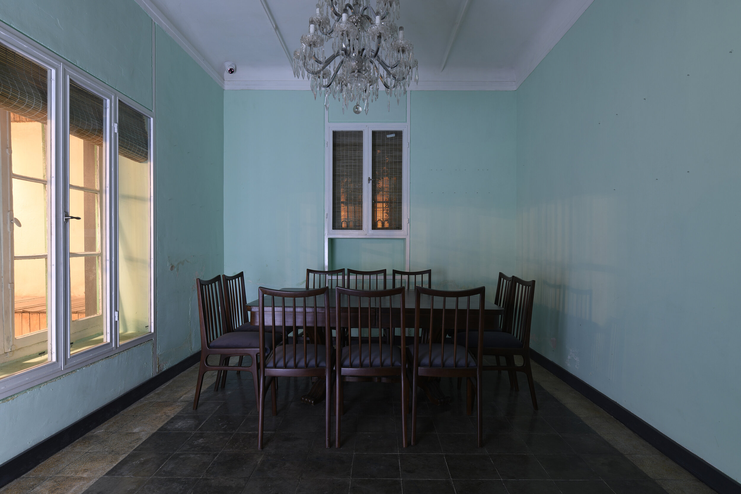  Communal room in the gallery’s ground level.   Wooden Dinning Table 450 x 250 x 130 cm  