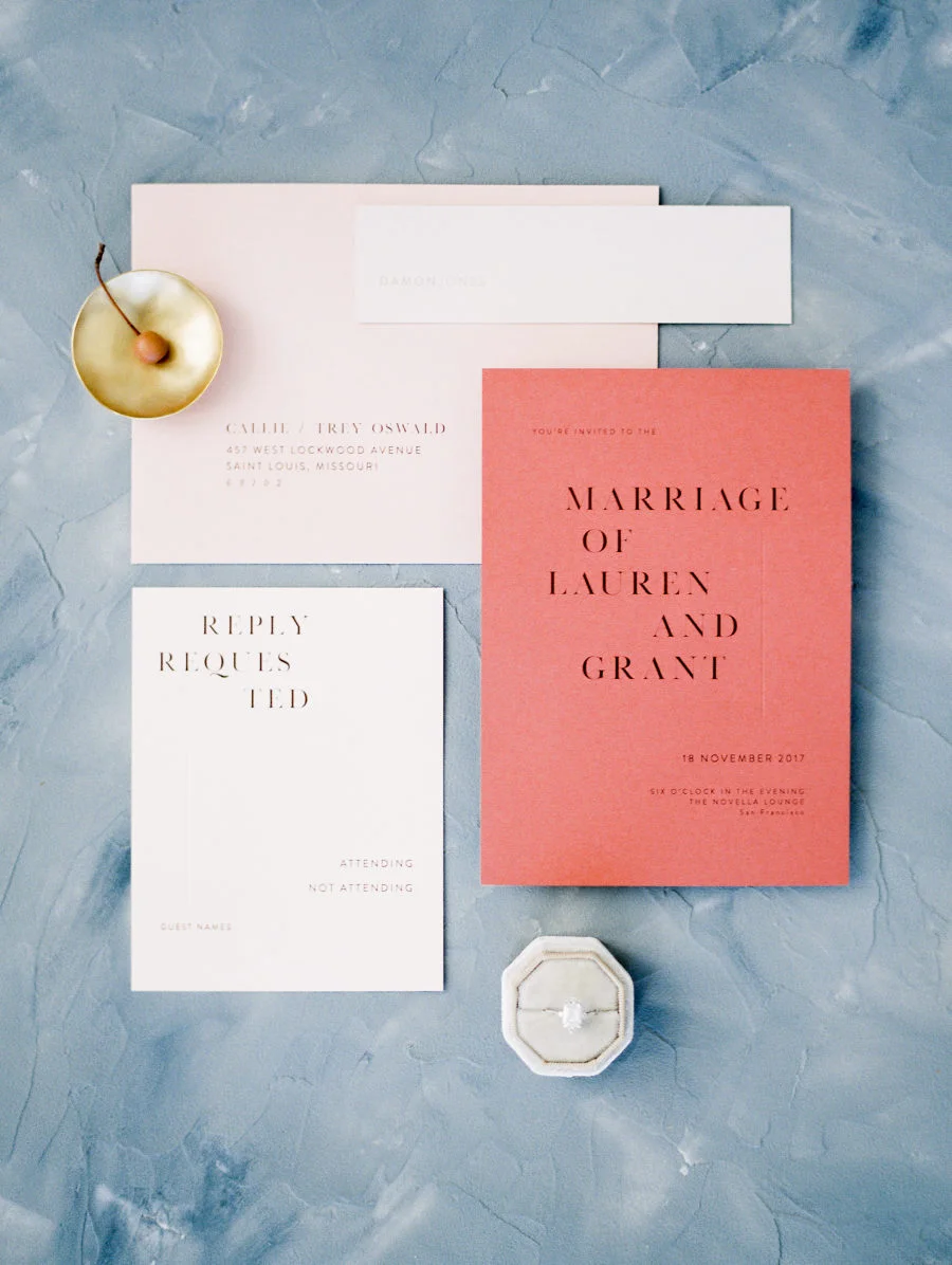 This stationery suite by Refine Studio is another example of how coral can be used to make a statement, but without taking over. Very chic. Photo by Jeremy Chou .