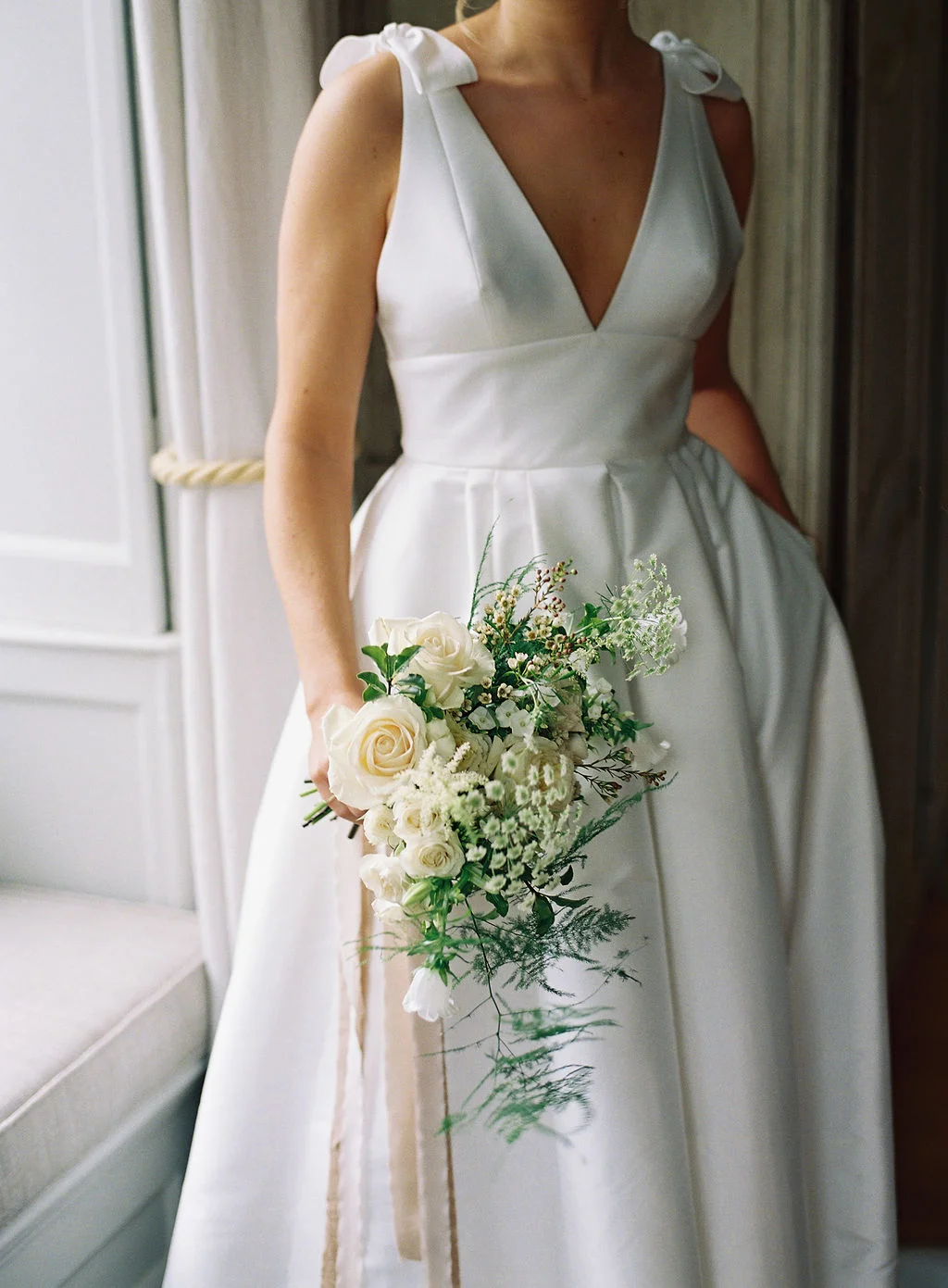 Bride and her beautiful bouquet at Thorpe Manor