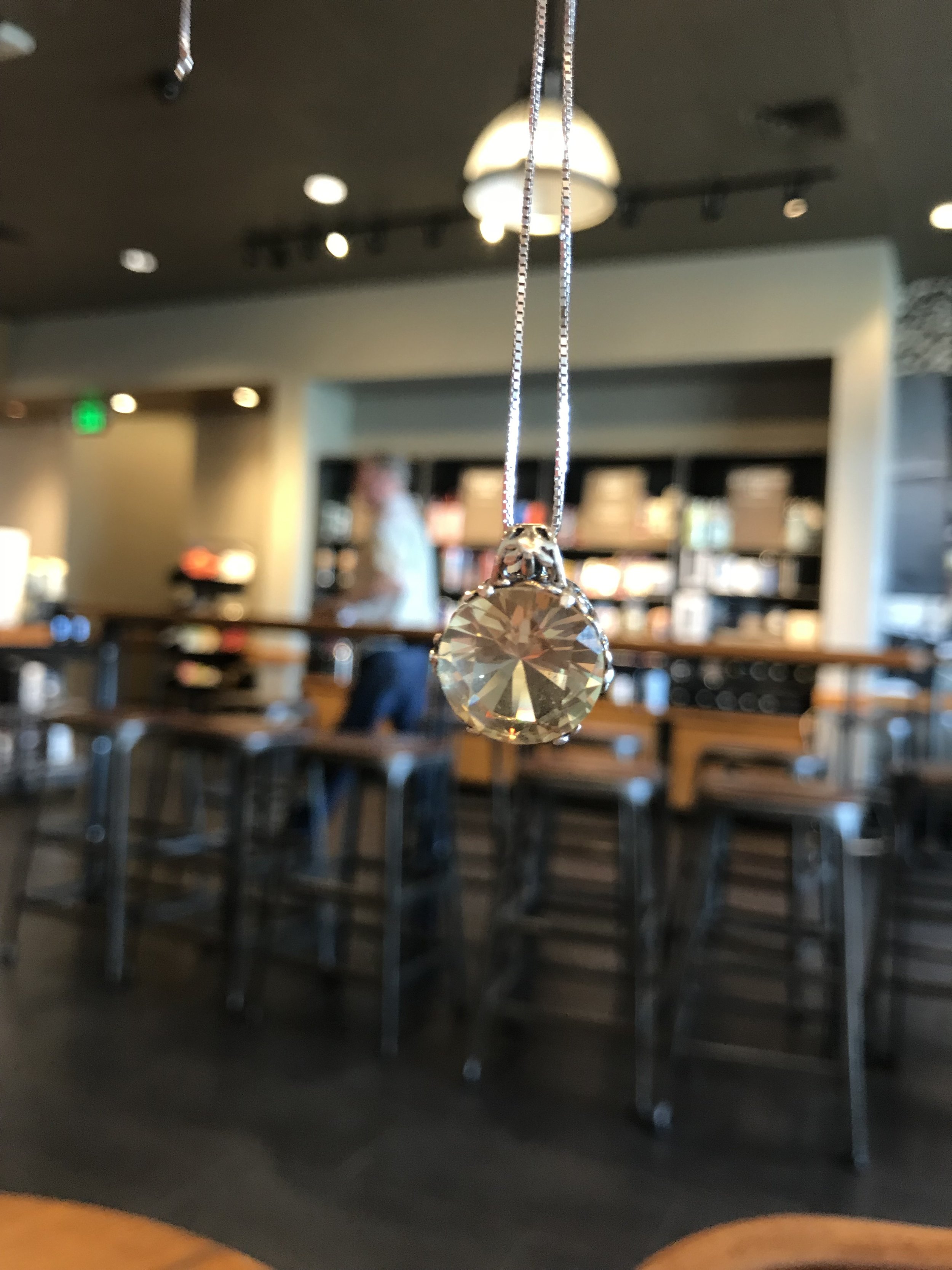 16mm sunstone pendant set in sterling silver; vintage look setting with a 20” sterling silver box chain ($350.00).