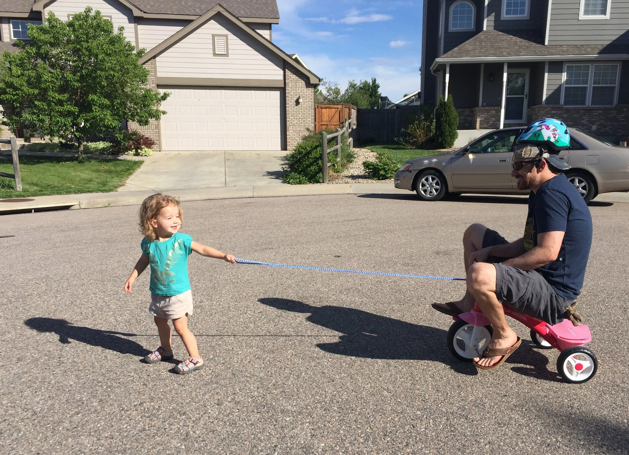 Rylee taking her dad for a bike ride