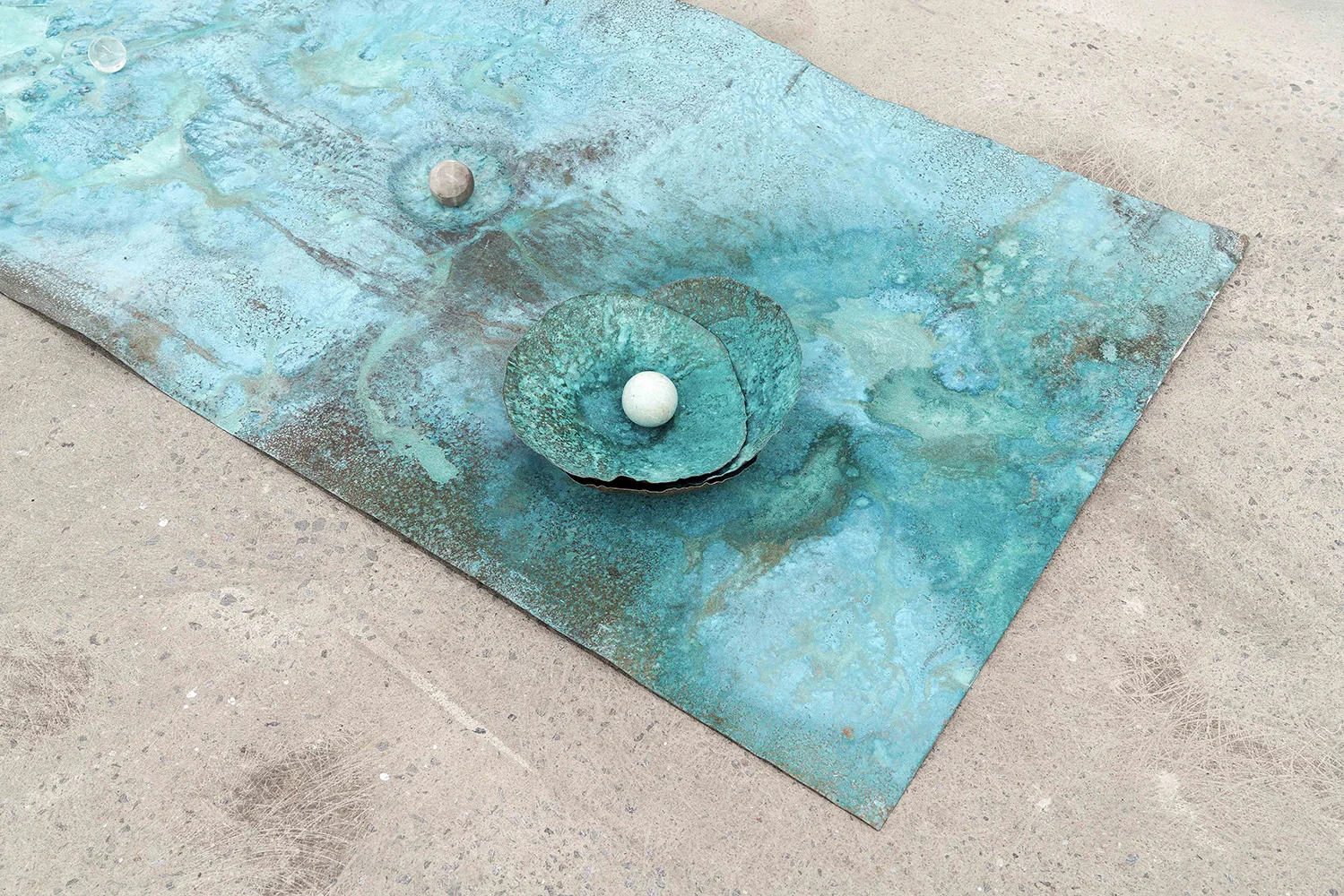 Lorna Bauer, The Toilers (detail) , 2018, copper, Miracle Grow patina, crystal sphere, 24” x 48” (61 x 122 cm)