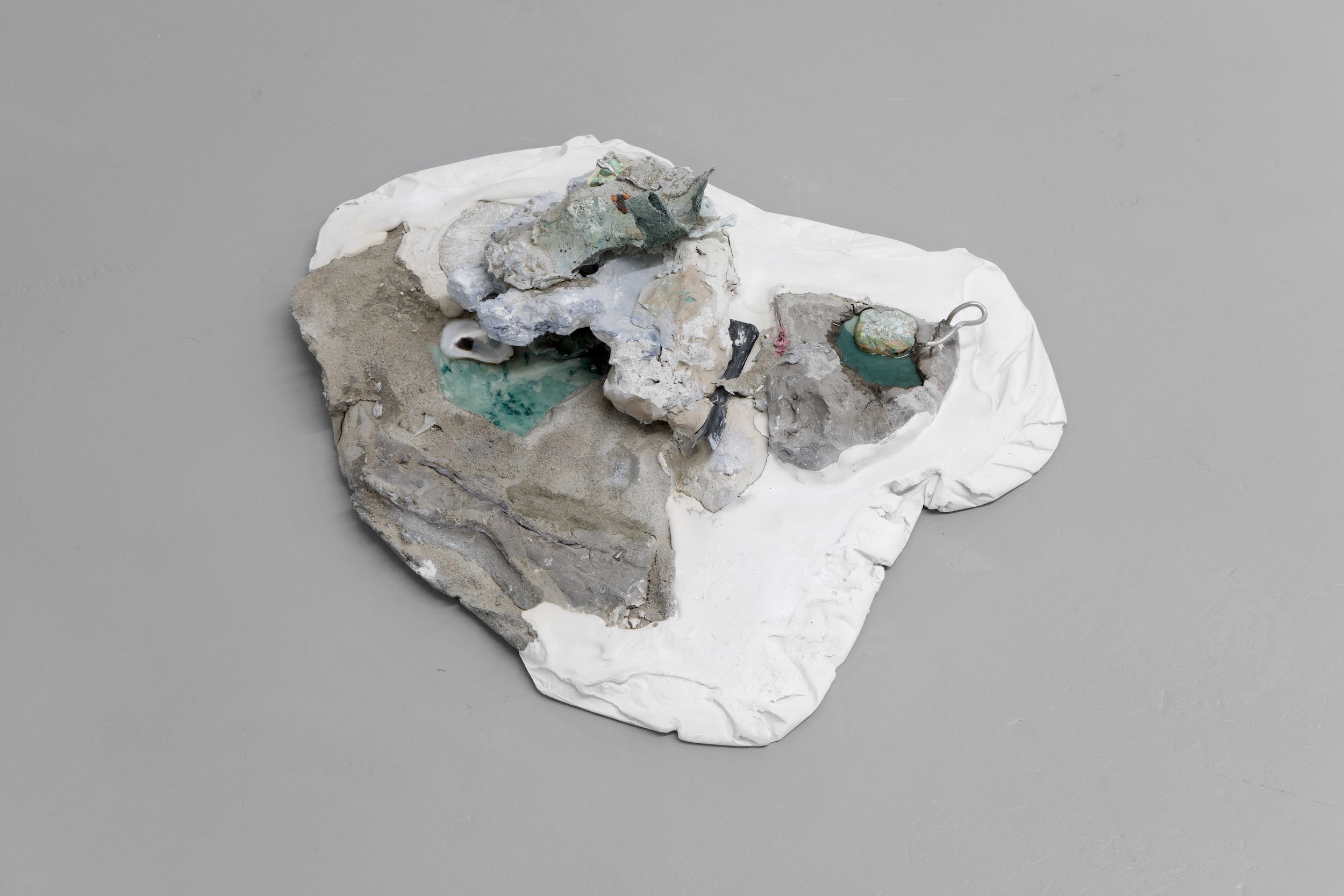  Laur P,  Before extraneous lines appeared on our chest , 2024, Plaster, concrete sand, dry pigments, solder metal, unfired clay, oil paint residues, drywall tape, aluminum foil pan, piece of plastic, ice melter salt, metal wire, oyster shell, concre