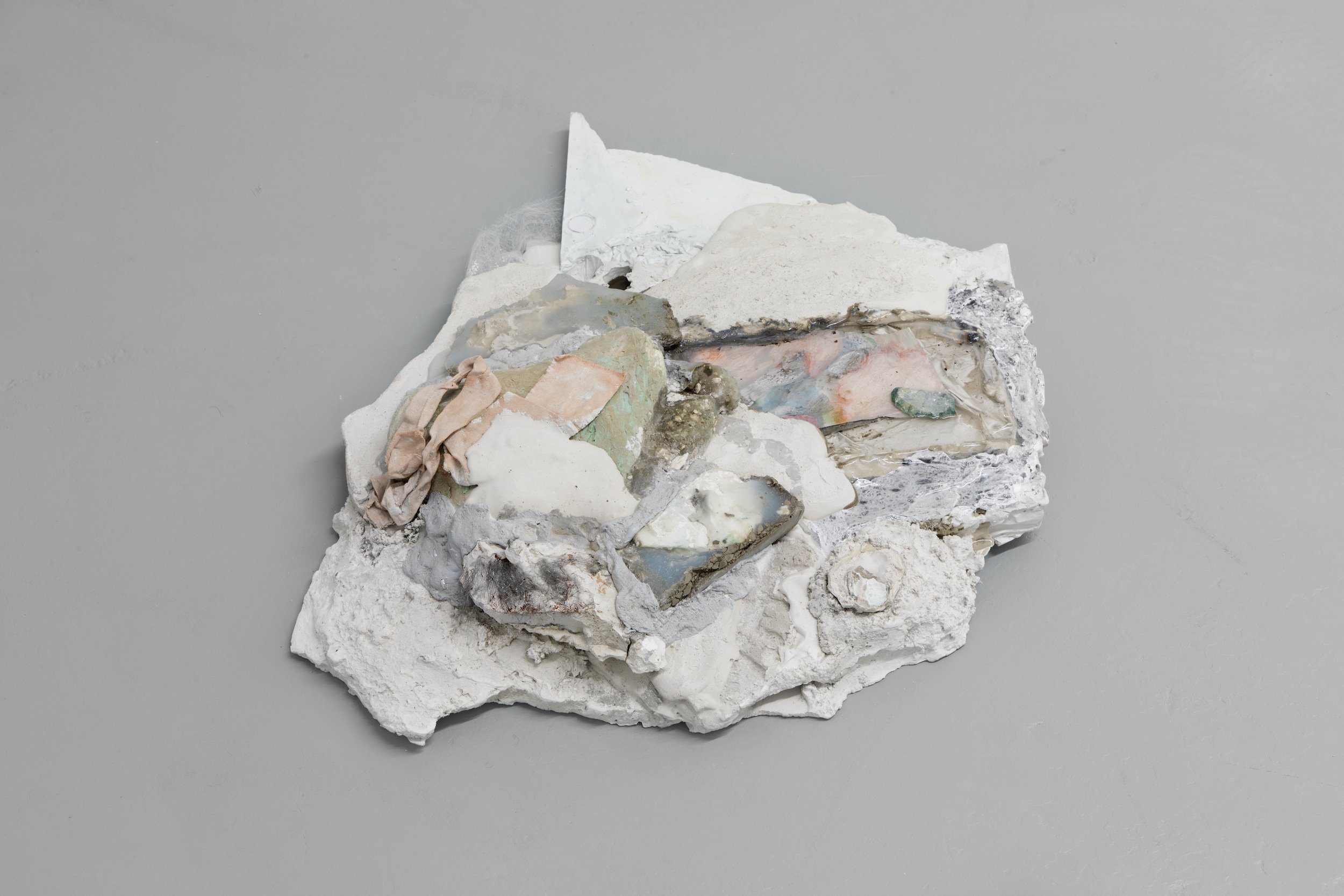  Laur P,  There there, another blink, another green alibi , 2024, Watercolour, acrylic and aluminum leaf on paper, fragments of plaster casts, dry pigments, epoxy resin, acrylic paint, silicone, trans tape, concrete sealant, 54.6 x 40.6 x 12.7 cm  (2