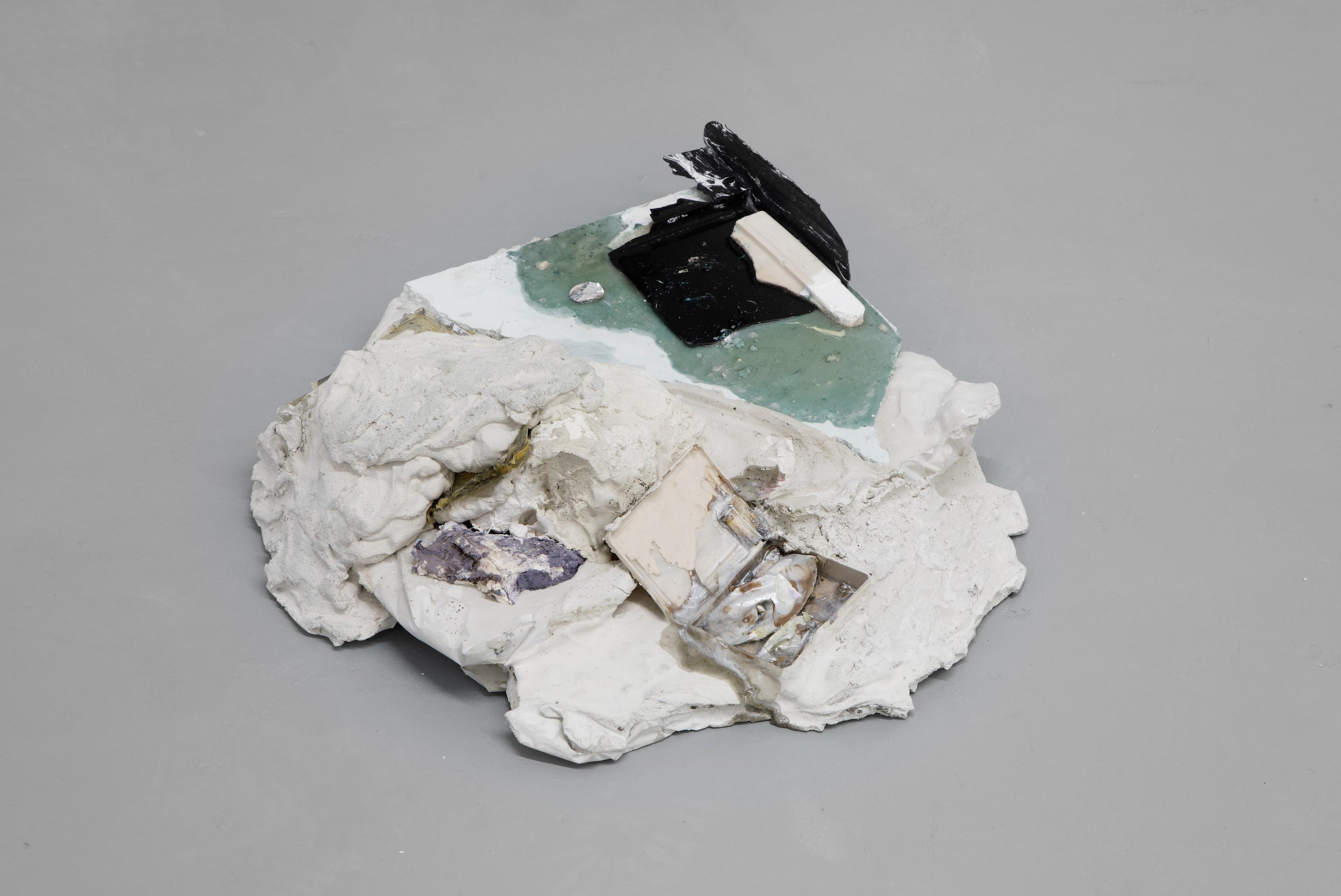  Laur P,  Those who made it through ages and those who couldn’t , 2024, Fragments of plaster casts, epoxy resin, paper pulp, dry pigments, piece of plastic tray, solder metal, plaster, concrete sand, aluminum foil seal cap, plastic container, cigaret