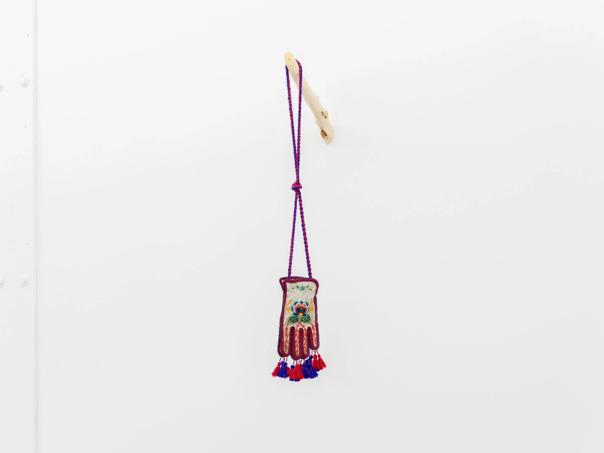 Haley Bassett,  Firebag, Alberta , 2025, Vintage and contemporary seed beads, steel faceted beads, thread, imitation sinew, wool yarn, cotton fabric, worn work gloves, poplar sapling, 50.8 x 14 x 20.3 cm (20 x 5.5 x 8 ") with support