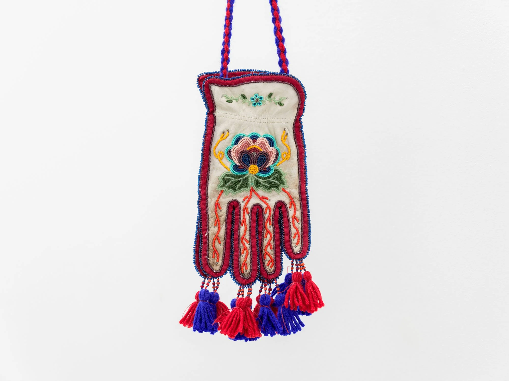 Haley Bassett,  Firebag, Alberta , 2025, Vintage and contemporary seed beads, steel faceted beads, thread, imitation sinew, wool yarn, cotton fabric, worn work gloves, poplar sapling, 50.8 x 14 x 20.3 cm (20 x 5.5 x 8 ") with support