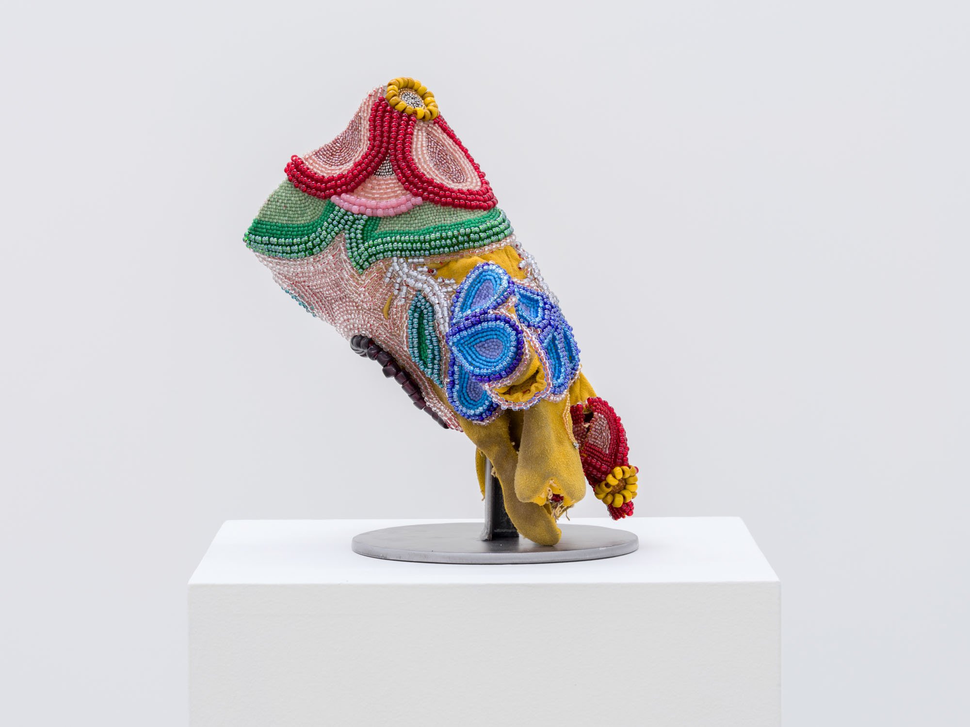 Haley Bassett,  Gauntlet , 2025, Vintage and contemporary, seed, pony and crow beads, vintage iron cut beads, thread, imitation sinew, and worn welding glove, 26.7 x 30.5 x 5.1 cm (10.5 x 12 x 2 ")