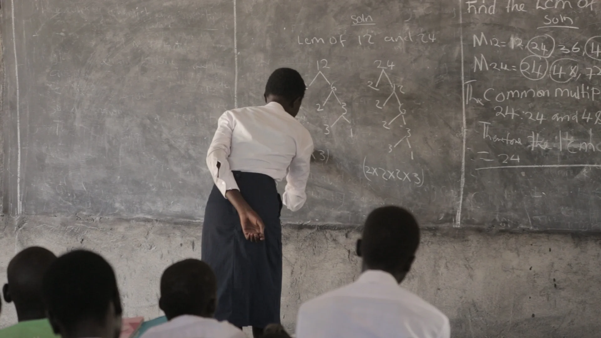 Female student volunteering in class.