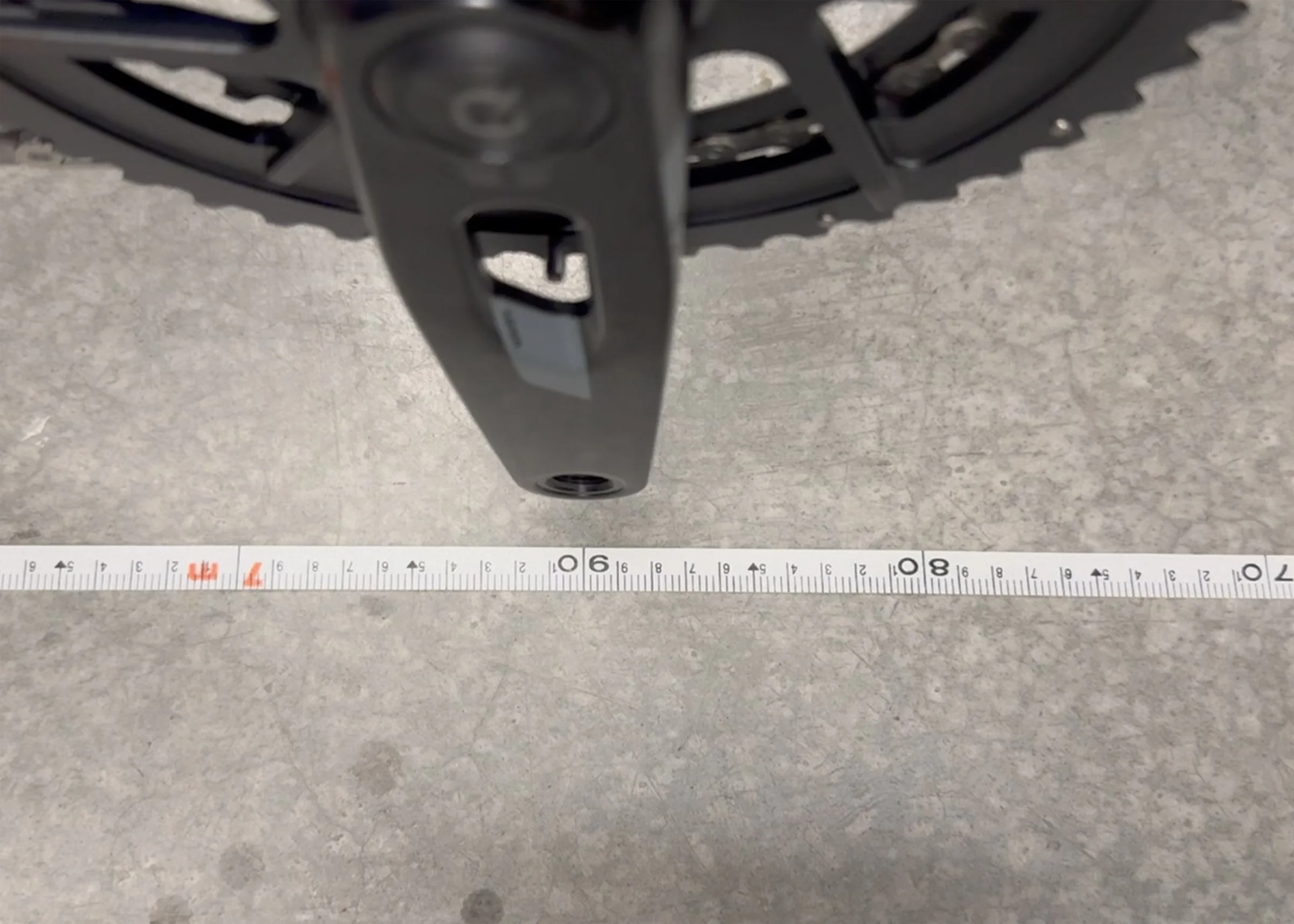 Tape measure showing 6 point 90 metre rollout for youth triathlon bike compliance test
