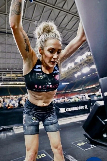 Nat Lawrence competing in a HYROX event during a high intensity workout station.