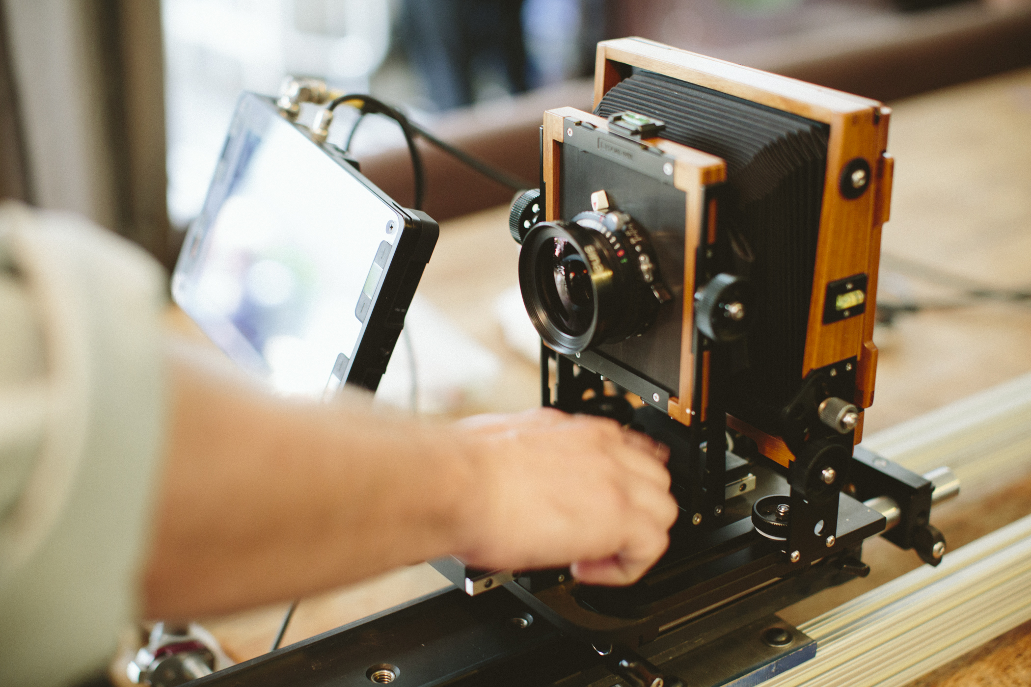 Filming digitally through an old portrait camera.