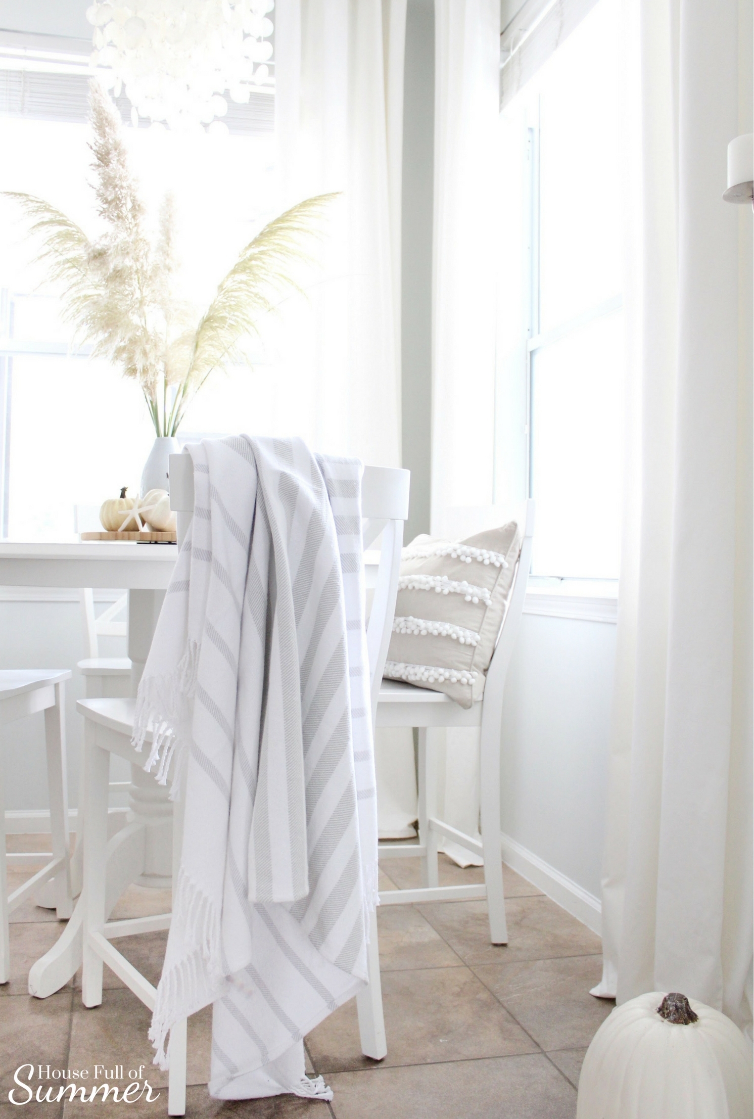 House Full of Summer: Fall Home Tour Blog Hop - Cozy, Coastal, Chic Breakfast nook fall decorating ideas. eat in kitchen, dining table, Neutral interior, white pumpkins, fall centerpiece, round counterheight table