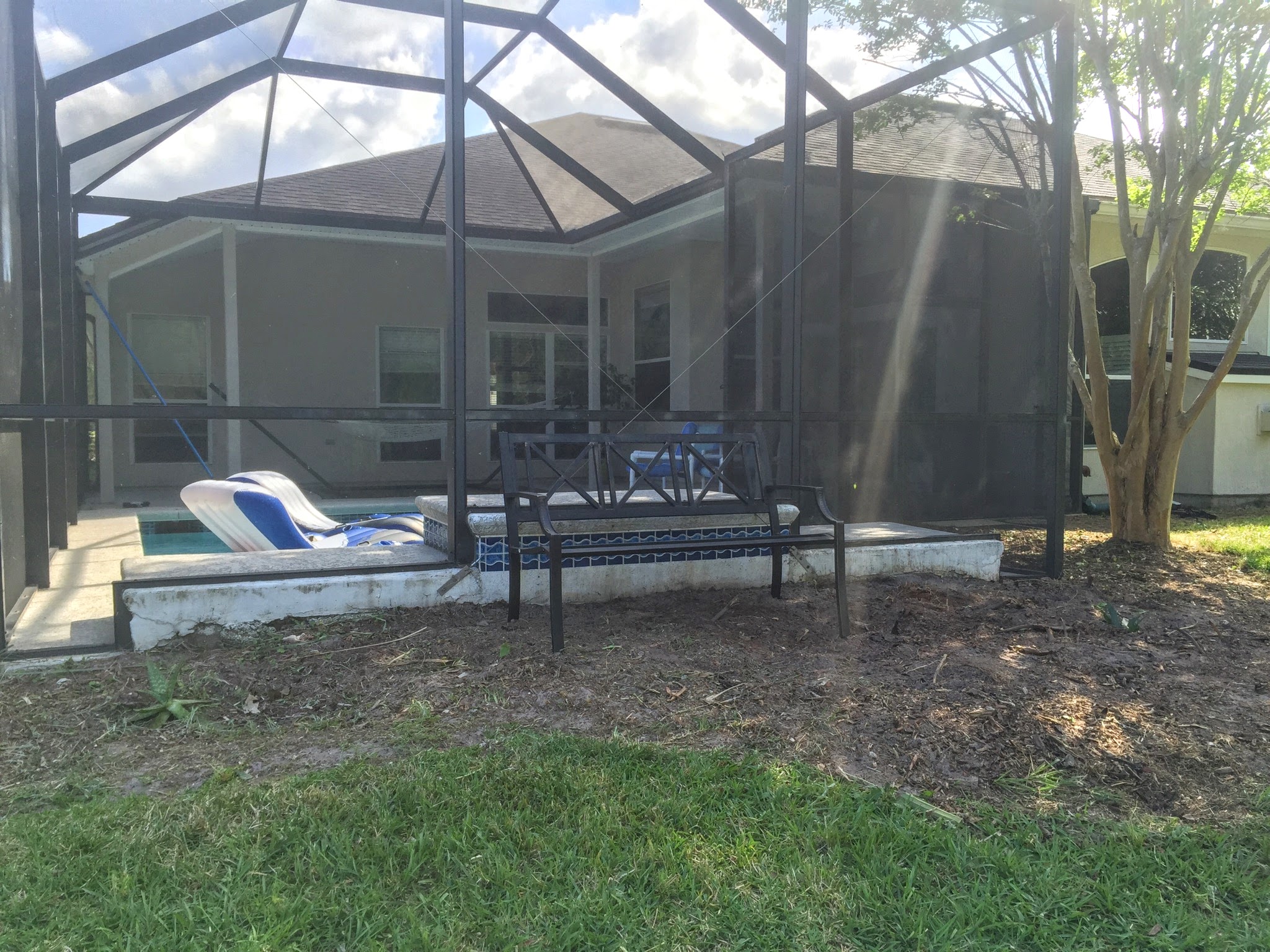  How We Turned Our Boring Backyard Into a Our Own Little Slice of Paradise | House Full of Summer backyard before and afters pool enclosure Florida home water view backyard design, coastal home, overgrown backyard, patio design, pool and pond, landsc