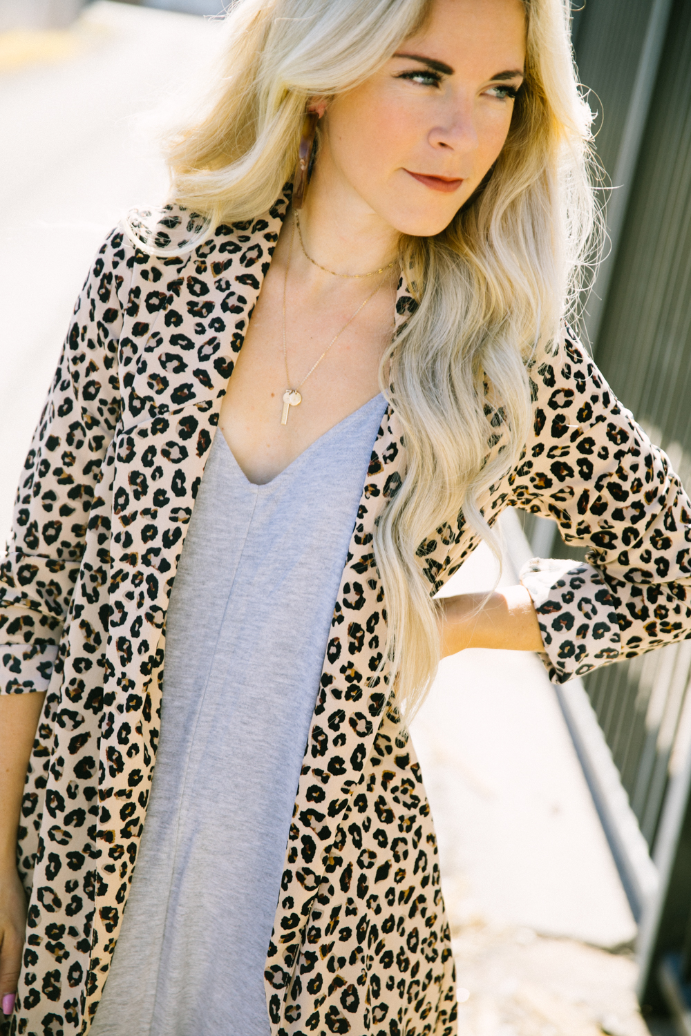Top Las Vegas fashion blog, Life of a Sister, shares their tips on how to style your Shopbop Romper: image of a woman wearing a leopard print blazer, Sam Edelman pink pumps and a Shopbop grey romper