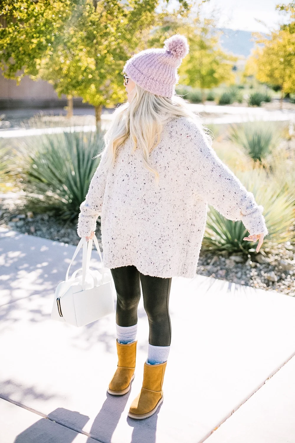 Holiday Shoe Gift Ideas with Kohls featured by top Las Vegas fashion blog, Life of a Sister: image of a woman wearing Koolaburras