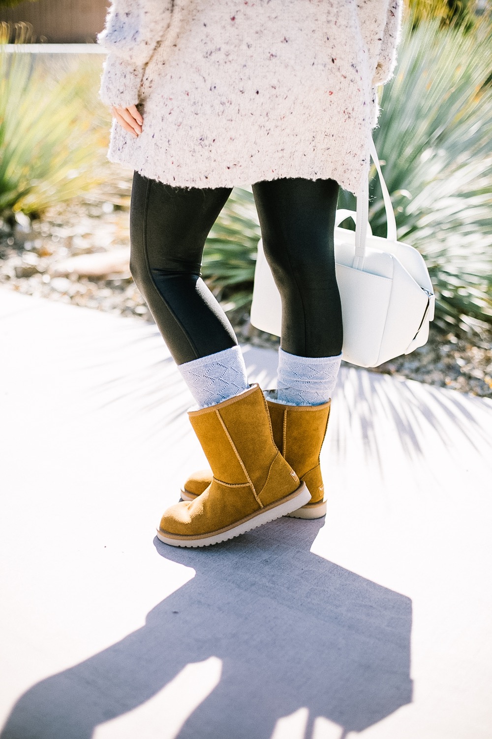 Holiday Shoe Gift Ideas with Kohls featured by top Las Vegas fashion blog, Life of a Sister: image of a woman wearing Koolaburras