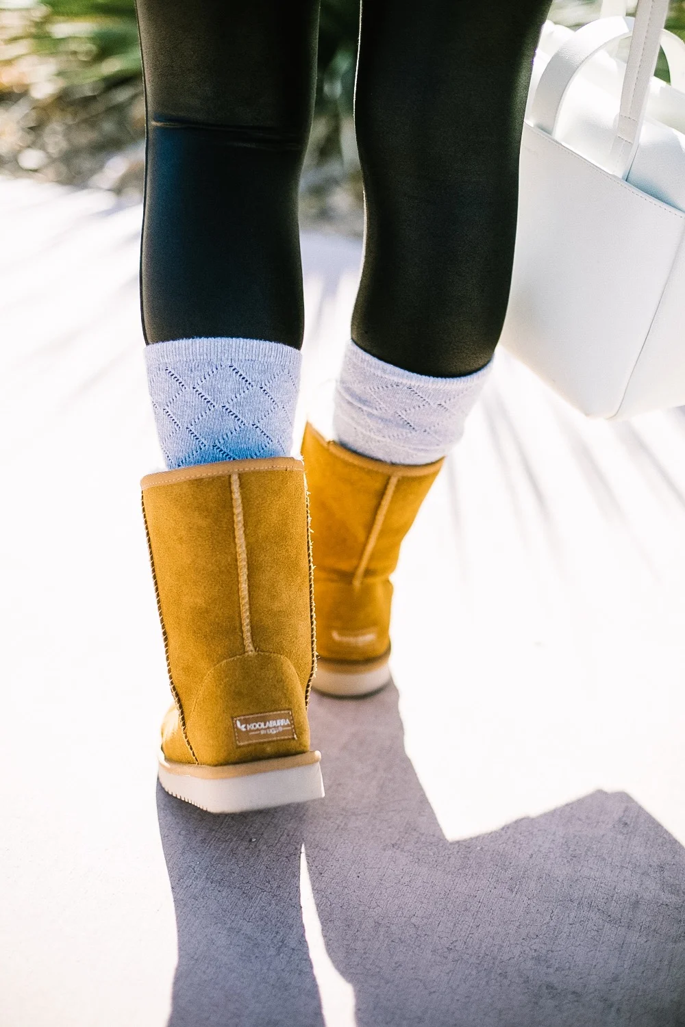Holiday Shoe Gift Ideas with Kohls featured by top Las Vegas fashion blog, Life of a Sister: image of a woman wearing Koolaburras