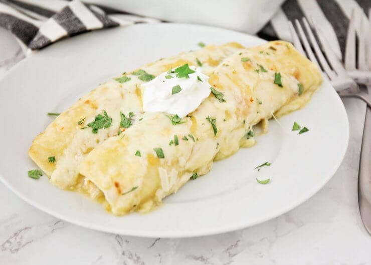 Easy Chicken Enchiladas Recipe featured by top US foodie blog, Life of a Sister