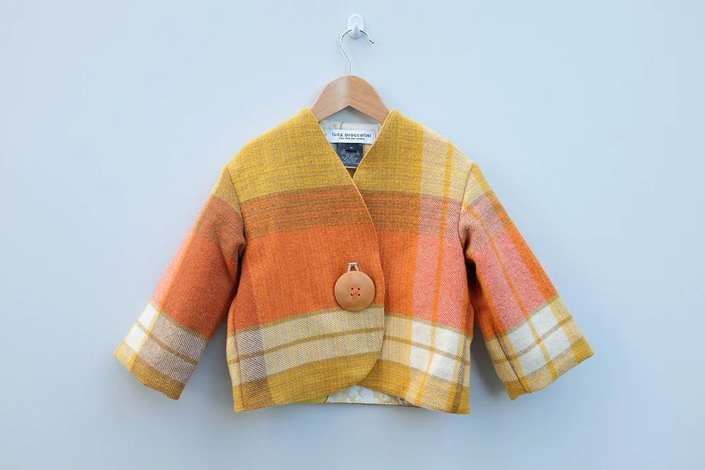 Kids cropped cozy wool jacket with floral lining and wood button by slow fashion brand luca broccolini.jpg