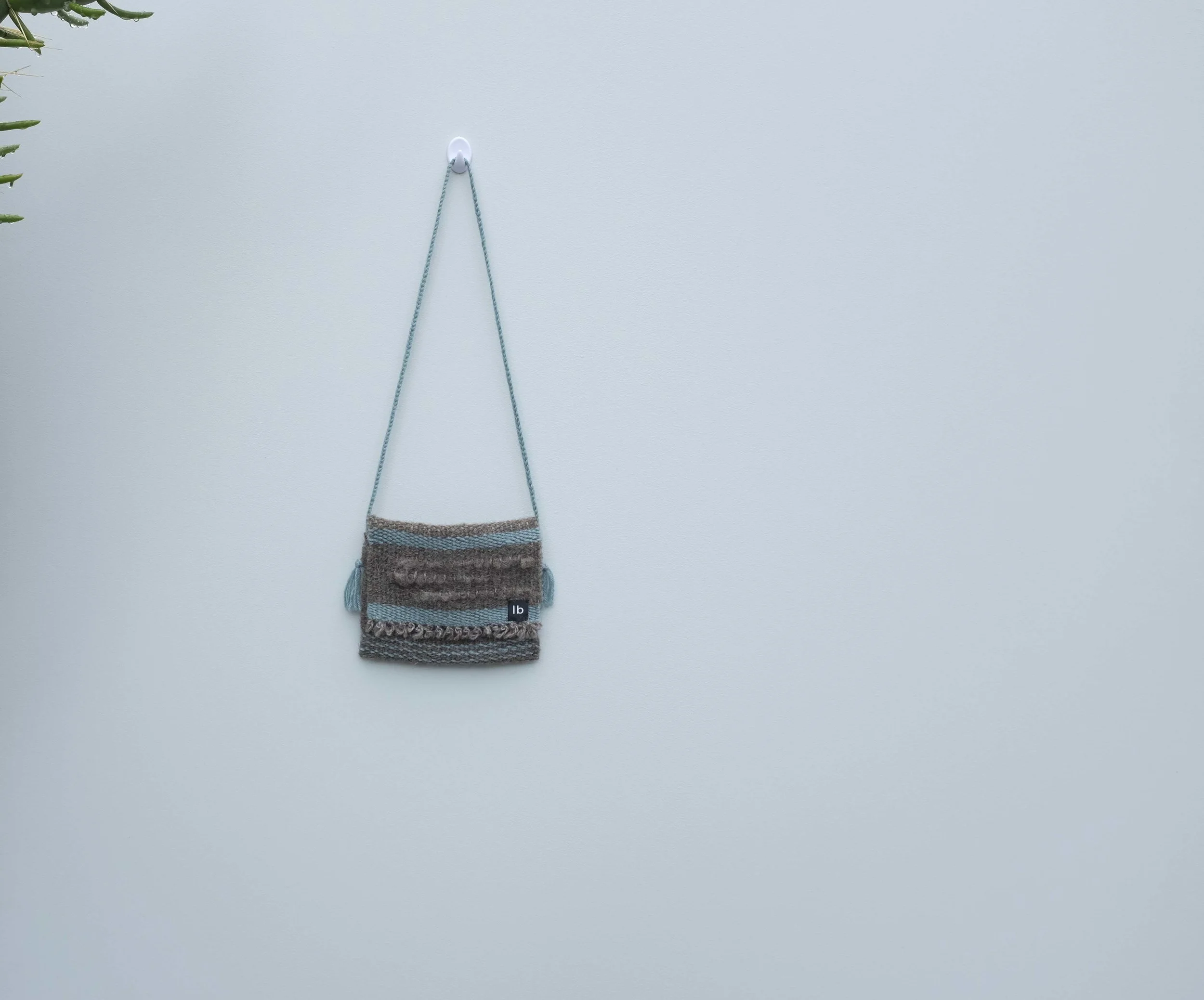 Hand woven slaughter-free wool bag by new zealnd made sustainable slow fashion unisex kids brand luca broccolini ..jpg