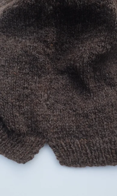 Childs vest with side splits in a chocolate brown slaughter free wool hand spun and hand knitted by luca broccolini.jpg