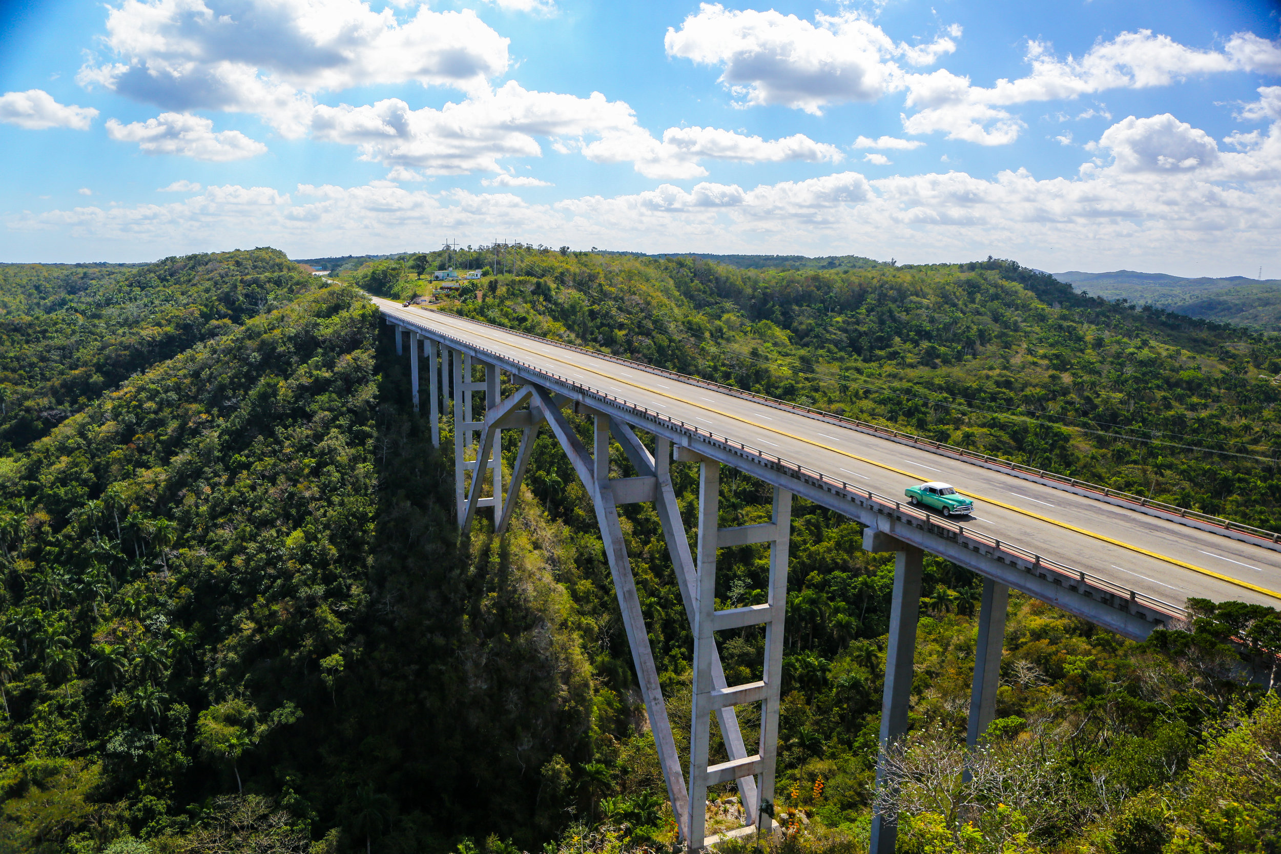 A classic American car crosses the Bacunayagua Bridge. March 8, 2019, in Santa Cruz del Norte, Cuba.