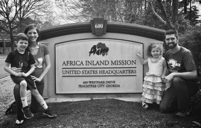 Family with AIM sign.jpg