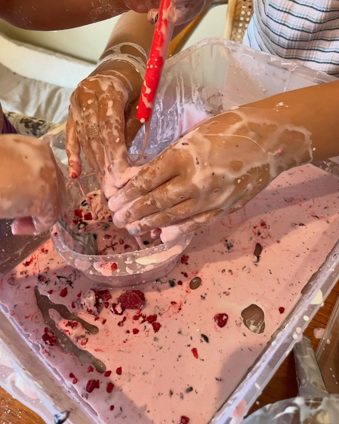 Simple sensory activity for the win! Goop = water + corn starch. Added frozen blueberries and raspberries for colour and extra fun :)