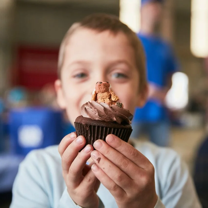Boy holding a cake