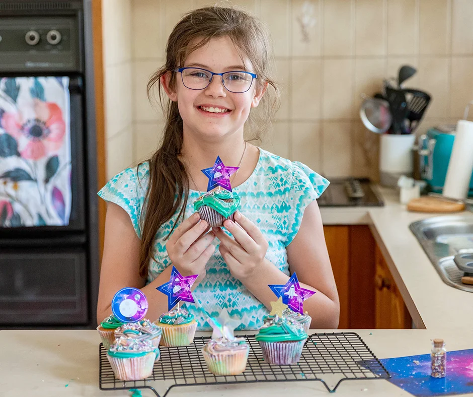 Abbey holding a cupcake.jpg
