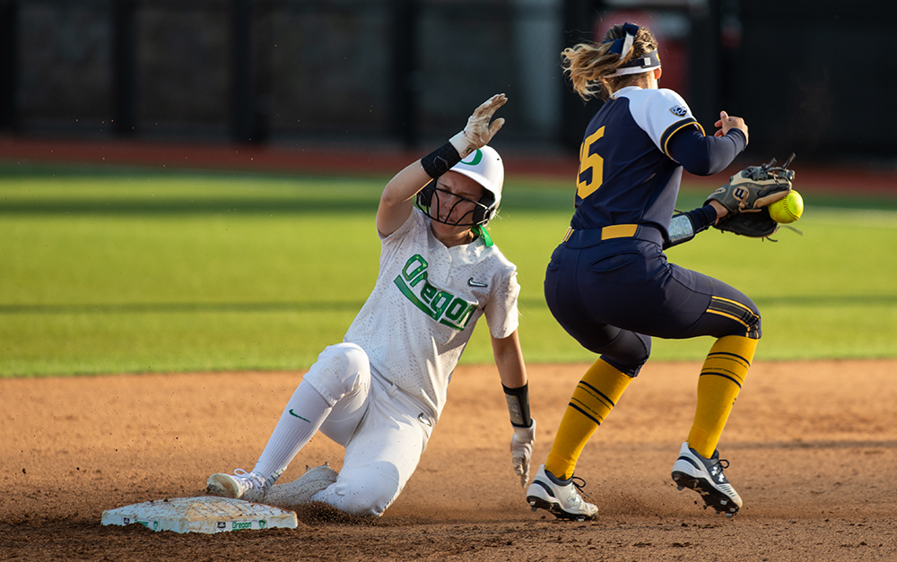  University of Oregon second baseman Allee Bunker avoids a tag out by UC Berkeley’s Lindsay Rood at second Thursday, April 18, 2019 in at Jane Sanders Stadium in Eugene. The Ducks beat the Golden Bears in a single-run performance at home, 1-0. 