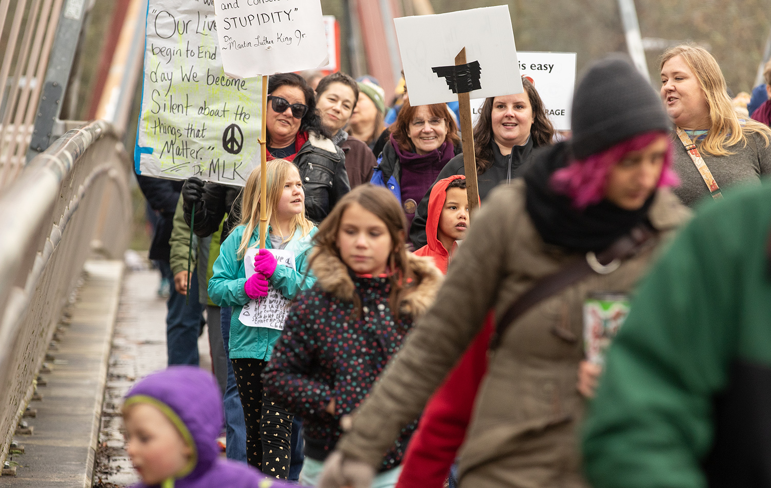  Claire Roswarth, 8, in blue, marches with Jacoby Harvey, 7, in red, and Brandy Rodtsbrooks and Leah Rosin. Rodtsbrooks said her family called off a holiday at Jacoby’s request. “We were going to take a long weekend to the coast and he made us come b