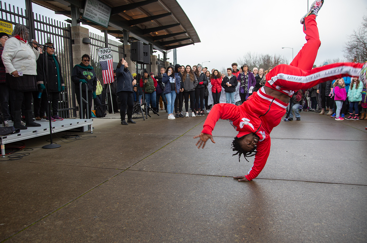  Facinet Sylla, of Eugene, dances in front of a crowd during a Martin Luther King Jr. rally outside Autzen Stadium Monday, Jan. 21, 2019, in Eugene. 