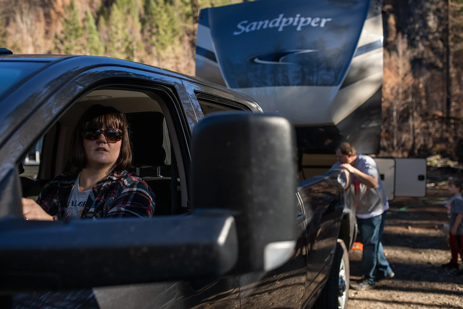  Tia Cloke maneuvers a pickup from under a fifth-wheel trailer Nov. 1, 2020, in Blue River. 