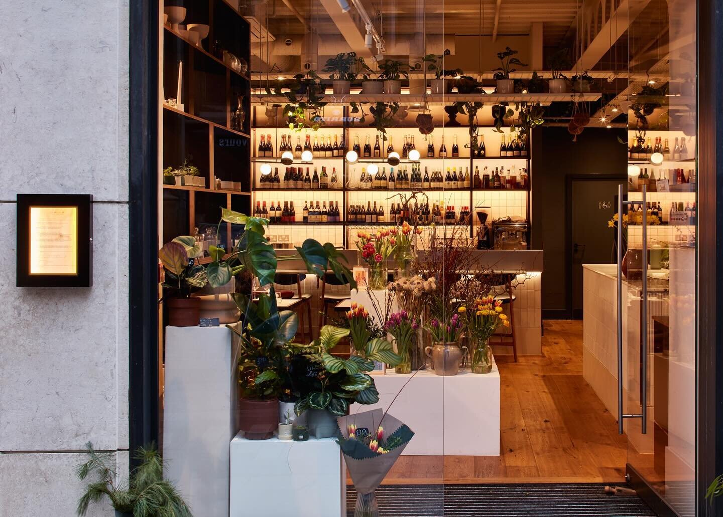 We like to make an entrance! 😂🙉

Both a restaurant and a florist, we wanted to proudly showcase each aspect of the business in a way that didn&rsquo;t force them to compete on a small floor plan. 

Full height bespoke storage shelves screen off the