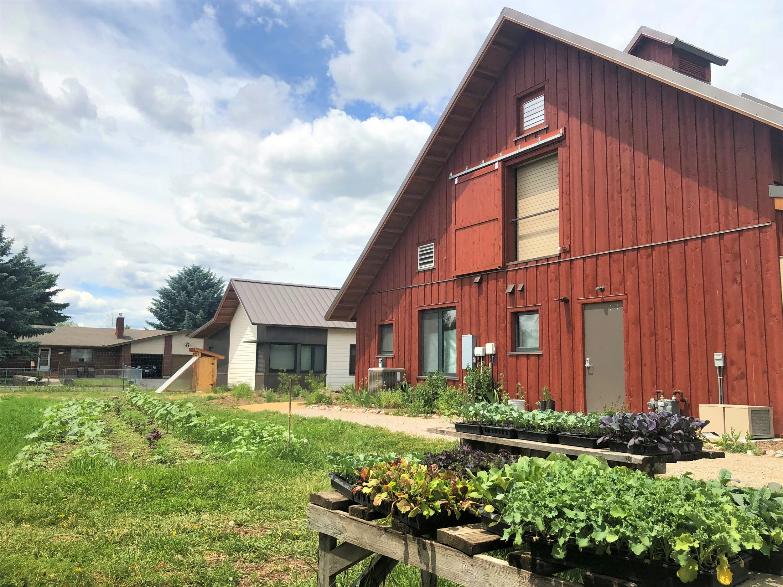 Back-side of the barn which meets up with the River Road Farm and native plant pathway.