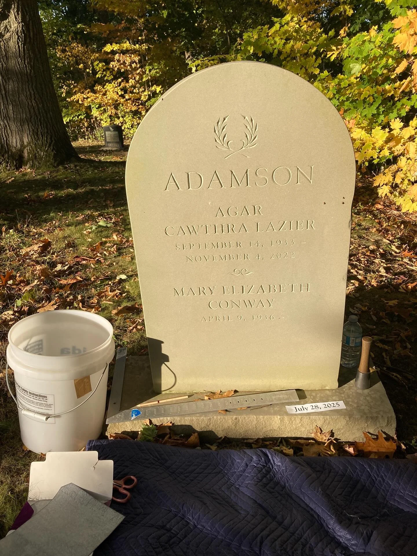 I do all my lettering with the stone horizontal on my banker so it&rsquo;s always an interesting exercise in contorting myself to add lettering to a stone I installed previously #stonelettering #handcarved #lettercarvinginstone #headstone #malletandc