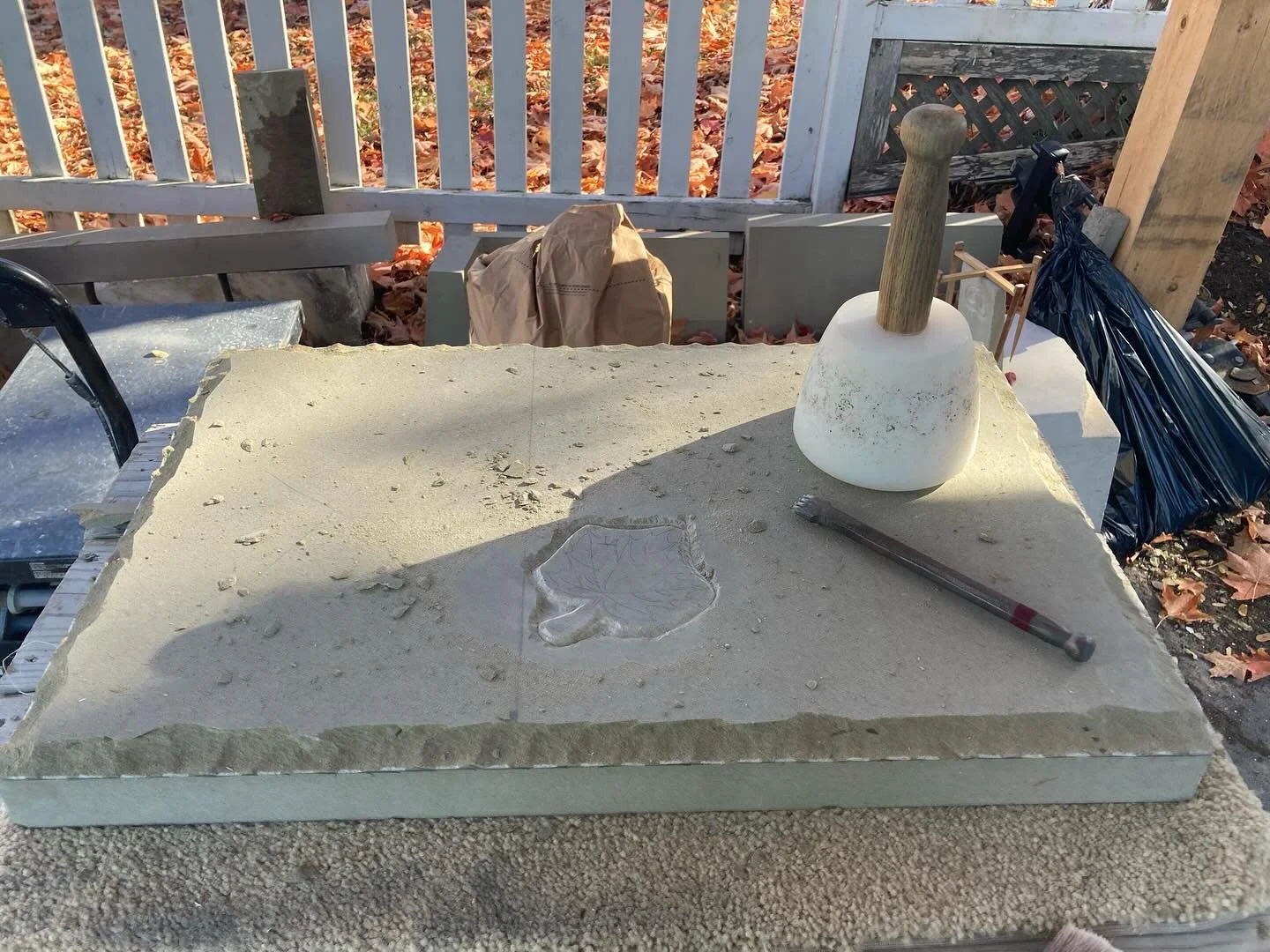 Getting started on a tablet memorial featuring a maple leaf as leaves fall around my studio. Now accepting commissions for Spring installation #handcarved #wallacequarries #sandstone #basreliefsculpture #mapleleaf #memorialtablet #headstone #traditio